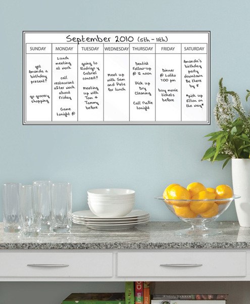 Aesthetic whiteboard weekly calendar decal in a modern home office setup