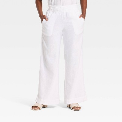 High-rise white linen wide leg pull-on pants showing a relaxed, casual fit