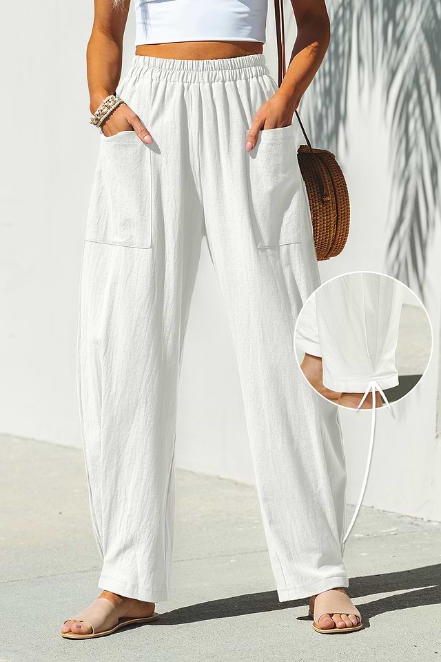 White cotton pants showing a slightly tapered leg fit