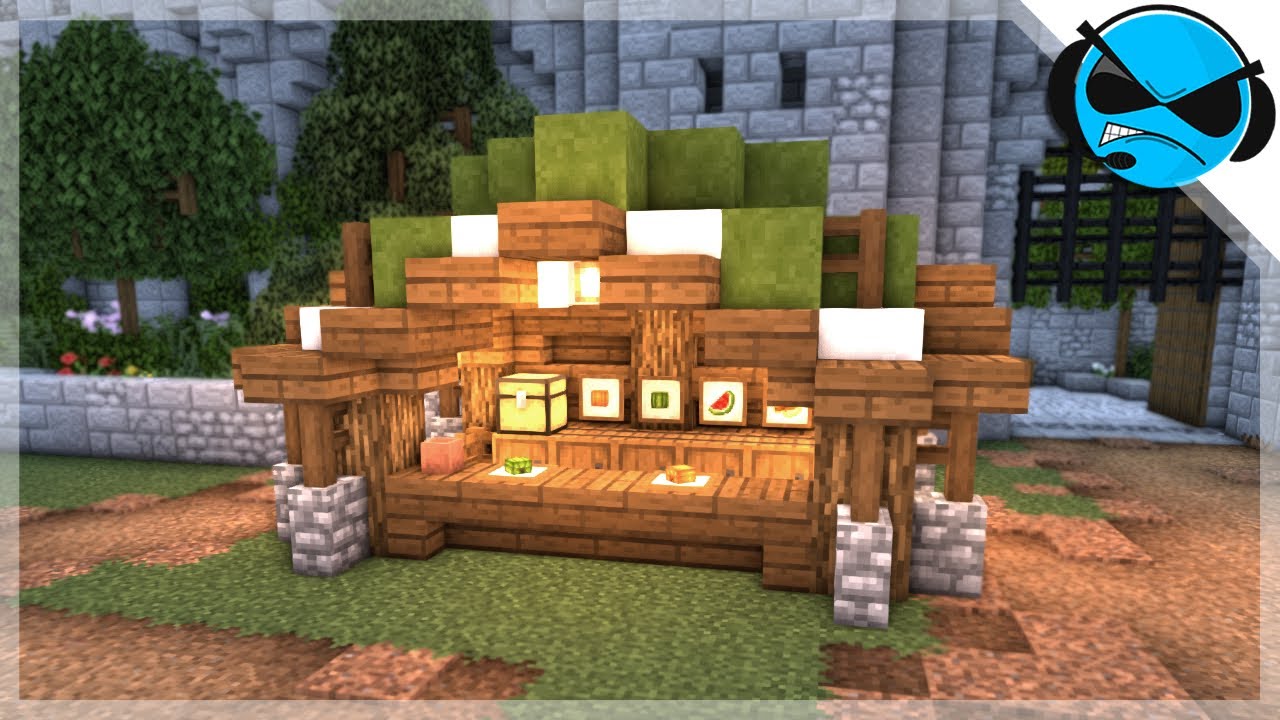 A classic medieval Minecraft market stall featuring a red and white wool roof and wooden supports